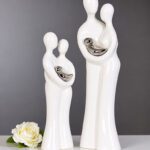 familiebeeld wit glas met zilverkleurige baby